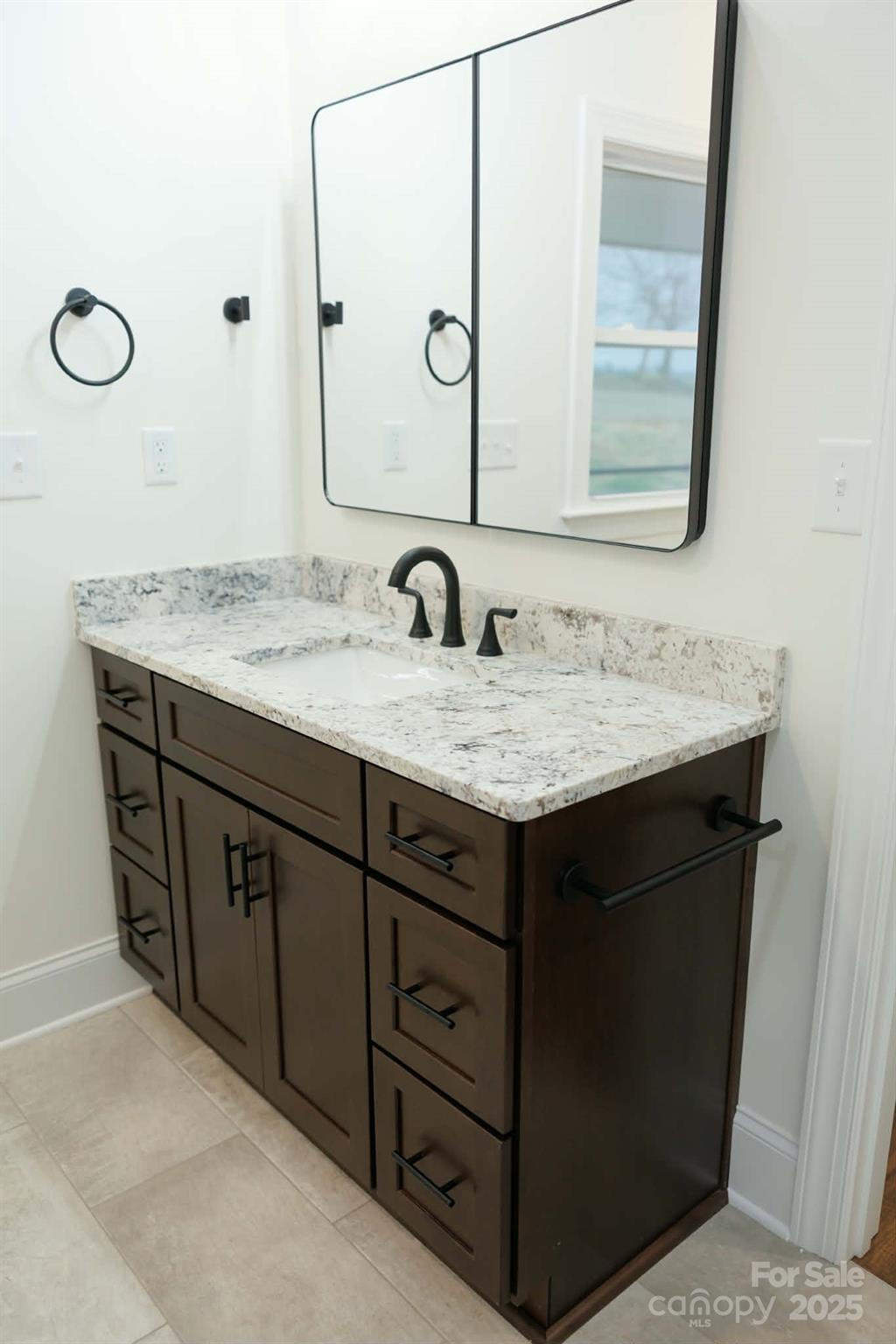 222 Guy Warlick Road Lawndale, NC 28090 - Photo 10 of 14 a bathroom with a granite countertop sink vanity and a mirror
