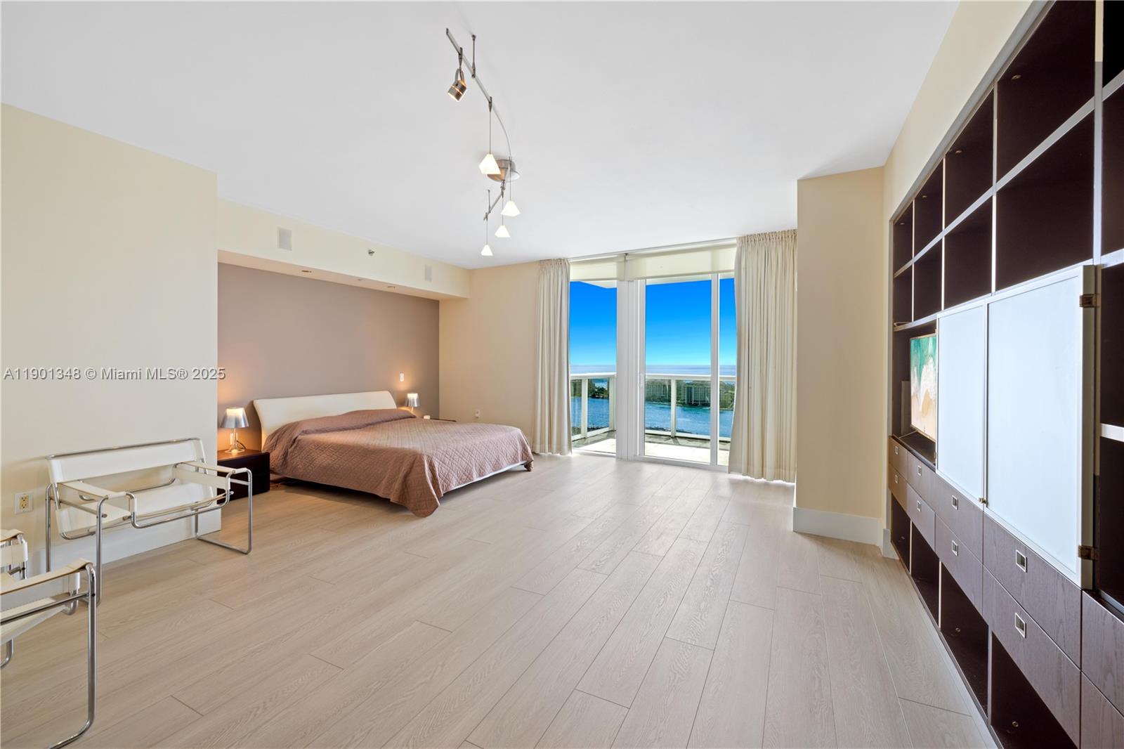 400 Alton Road, Unit 3006 Miami Beach, FL 33139 - Photo 13 of 28 a bedroom with a bed and a large window