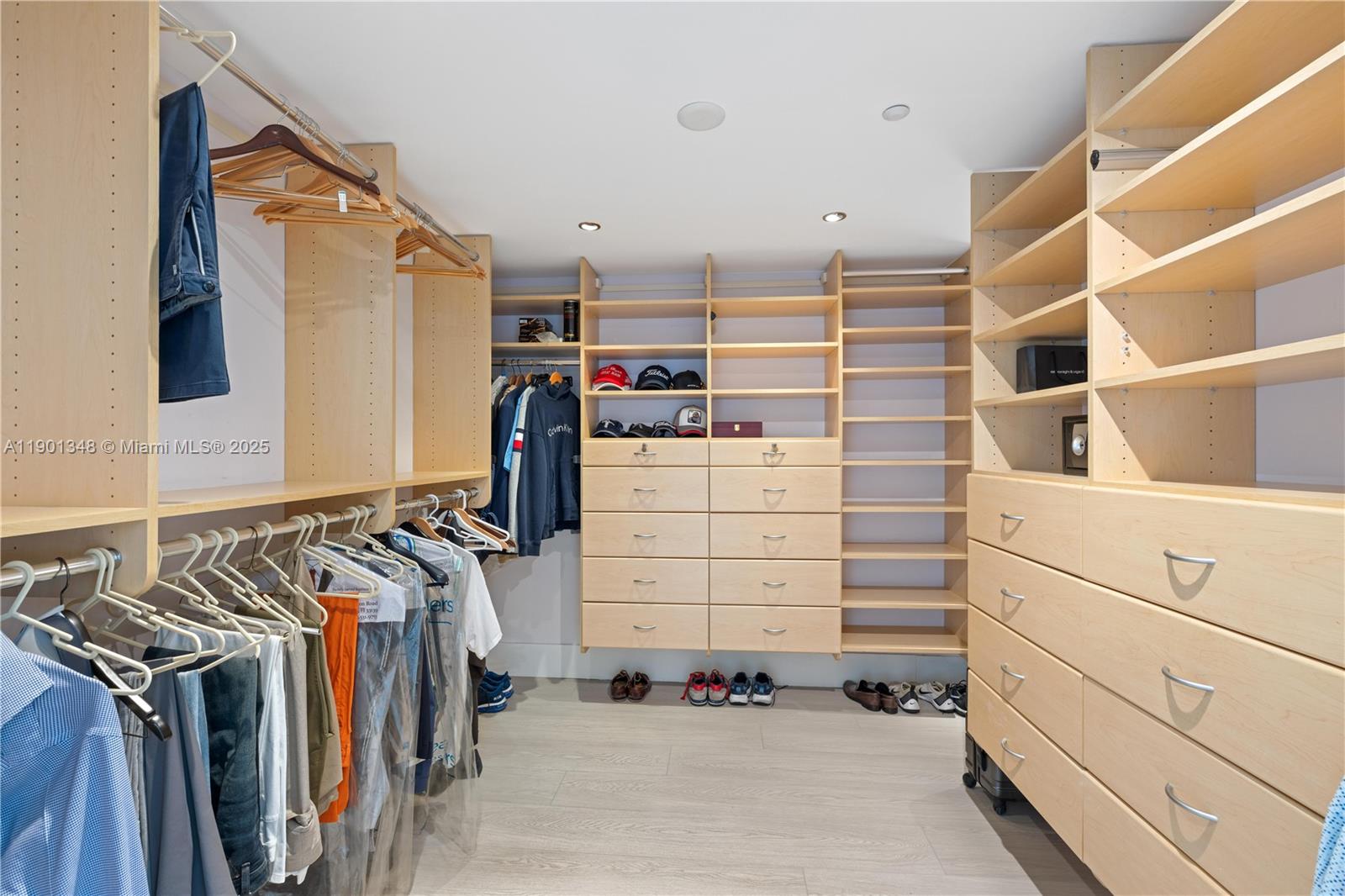 400 Alton Road, Unit 3006 Miami Beach, FL 33139 - Photo 17 of 28 a view of walk in closet with clothes and shoes