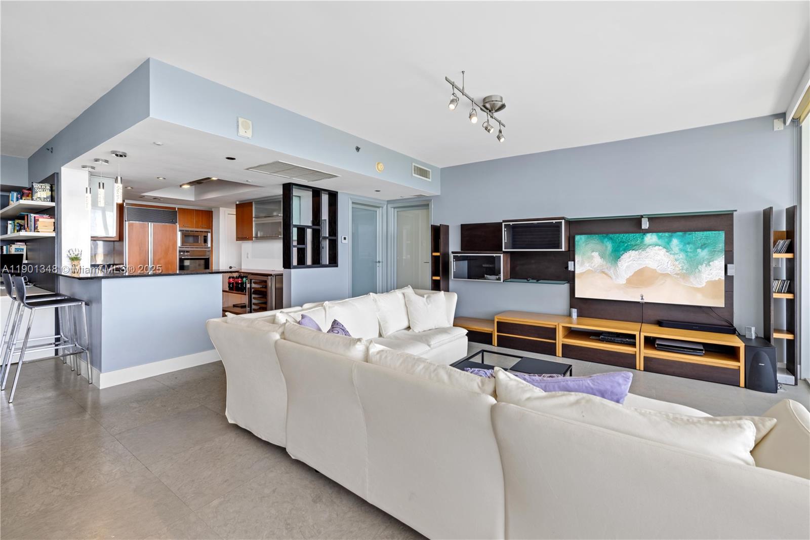400 Alton Road, Unit 3006 Miami Beach, FL 33139 - Photo 8 of 28 a living room with furniture and a flat screen tv