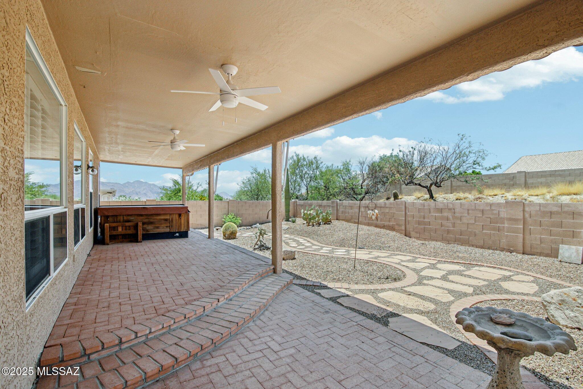 35890 Mesa Ridge Drive Tucson, AZ 85739 - Photo 25 of 31 a view of a house with backyard porch and sitting area