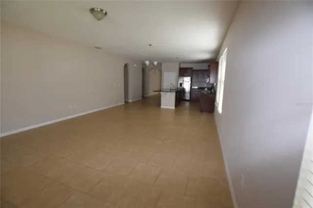 a view of a livingroom and a kitchen