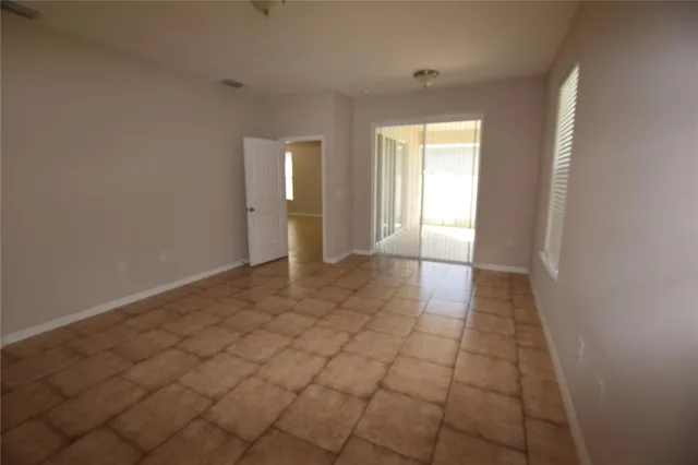a view of an empty room and window