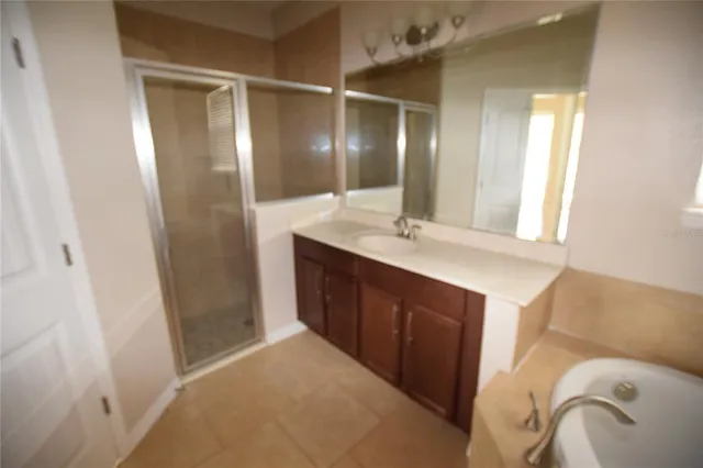 a bathroom with a double vanity sink and mirror