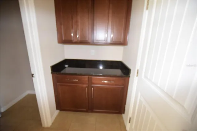 a view of a swimming pool with a table and chairs