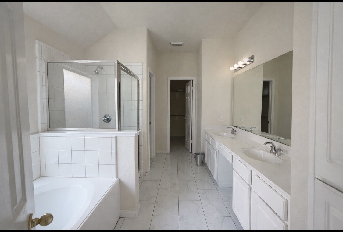11227 Agave Ridge Lane Houston, TX 77089 - Photo 6 of 10 a bathroom with a tub sink and mirror