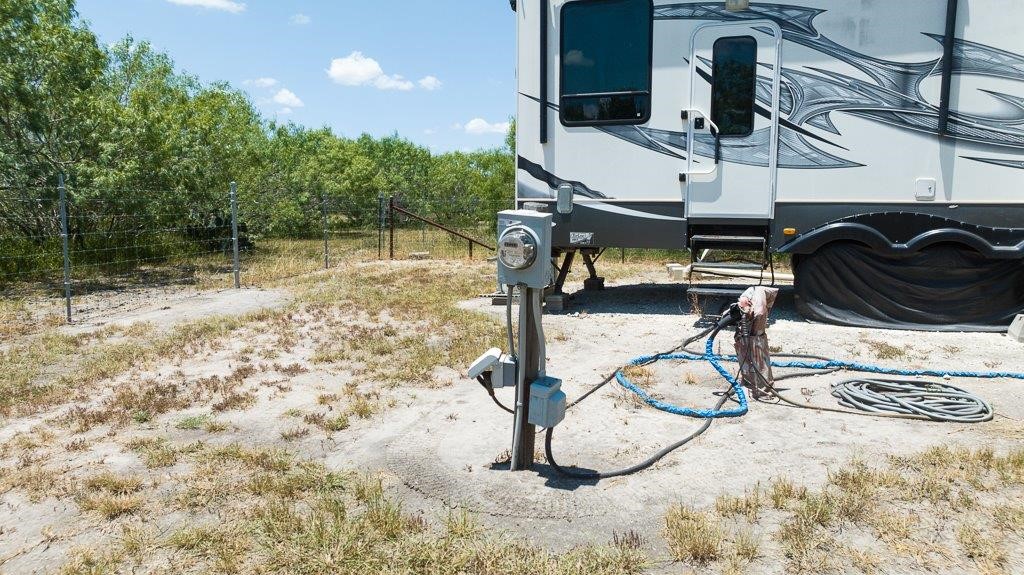 9223 County Road 2249 Sinton, TX 78387 - Photo 26 of 39 a view of a swimming pool with chairs