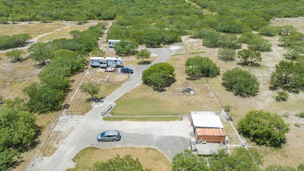 9223 County Road 2249 Sinton, TX 78387 - Photo 29 of 39 an aerial view of a house with yard swimming pool and outdoor seating