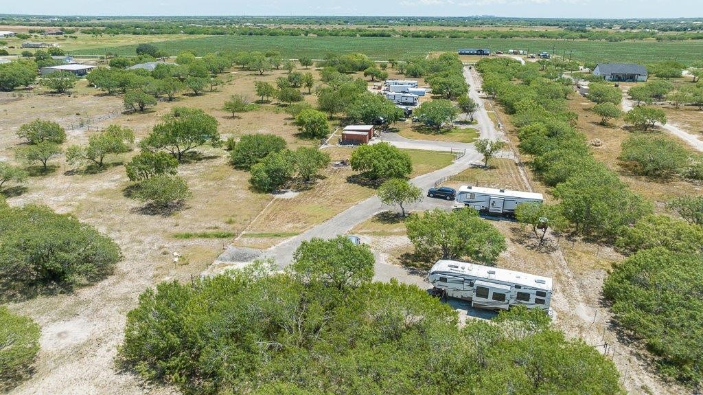 9223 County Road 2249 Sinton, TX 78387 - Photo 30 of 39 an aerial view of residential houses with outdoor space and trees