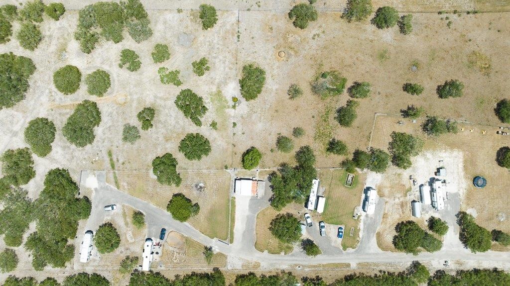 9223 County Road 2249 Sinton, TX 78387 - Photo 5 of 39 a picture of a bathroom with a shower curtain
