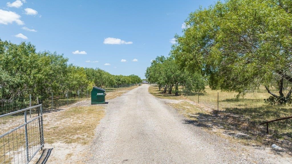 9223 County Road 2249 Sinton, TX 78387 - Photo 7 of 39 a view of a backyard with large trees