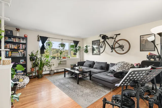 a bathroom with a sink vanity mirror and toilet