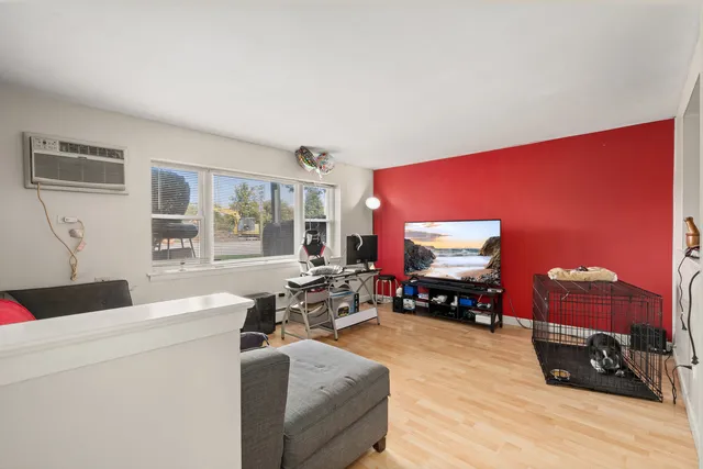 a bathroom with a toilet sink vanity and mirror