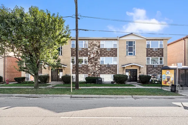 a front view of a building with garden