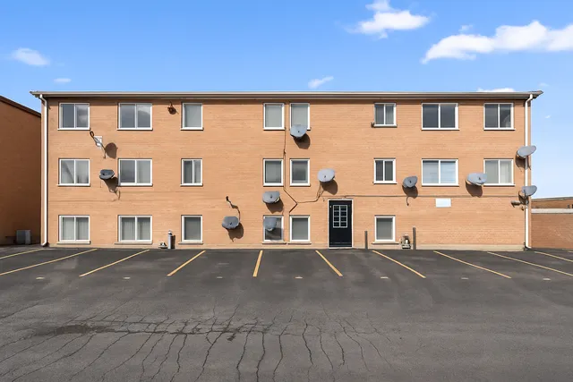 a front view of a building with many windows