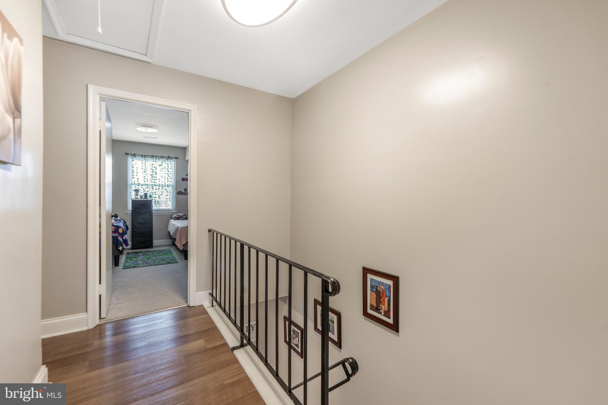 15307 Arbory Way, Unit 6 Laurel, MD 20707 - Photo 16 of 23 a view of a hallway with wooden floor and entryway