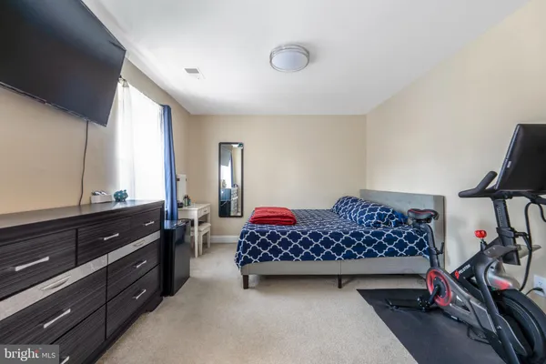 a bedroom with furniture closet and a window