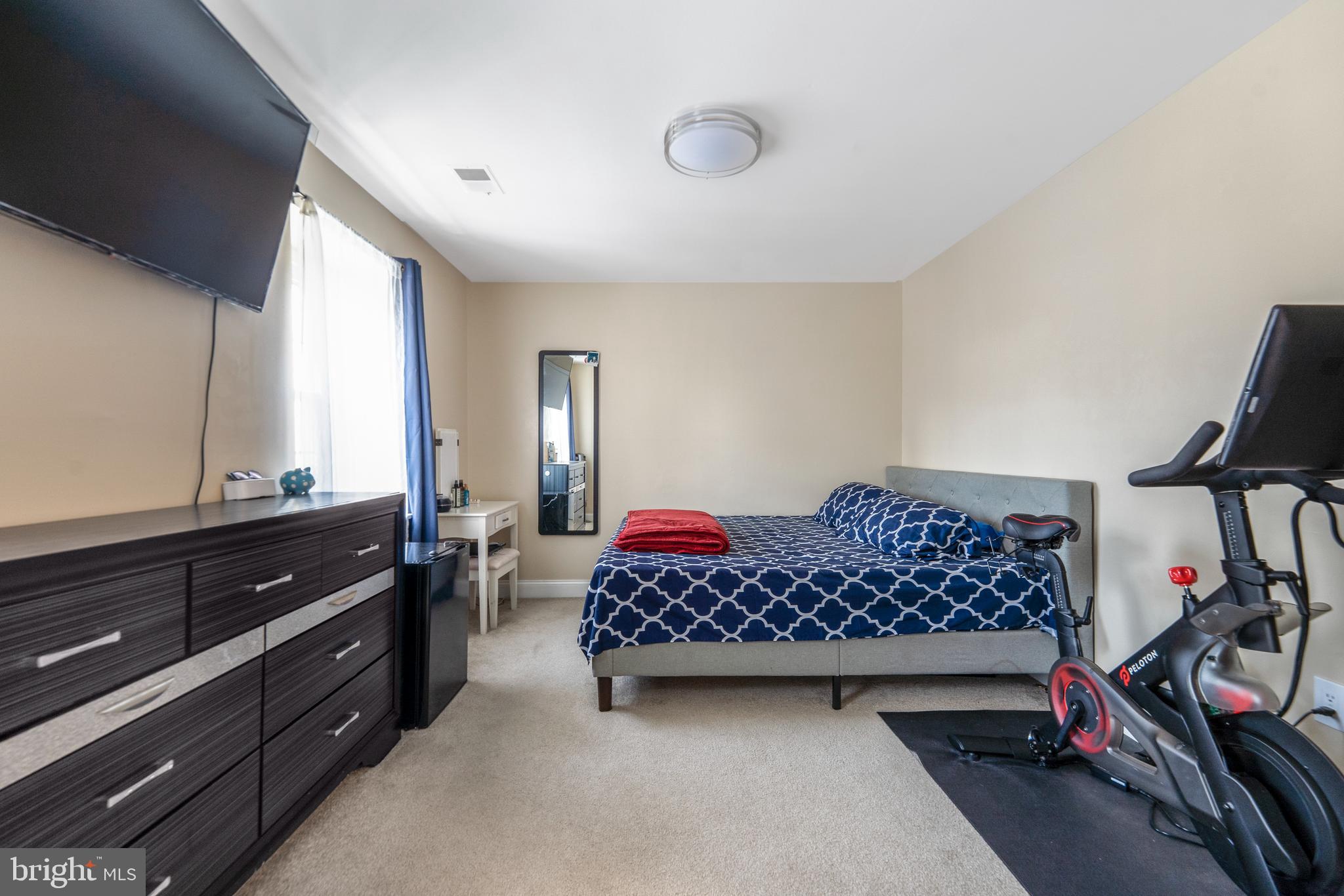 15307 Arbory Way, Unit 6 Laurel, MD 20707 - Photo 17 of 23 a bedroom with furniture closet and a window