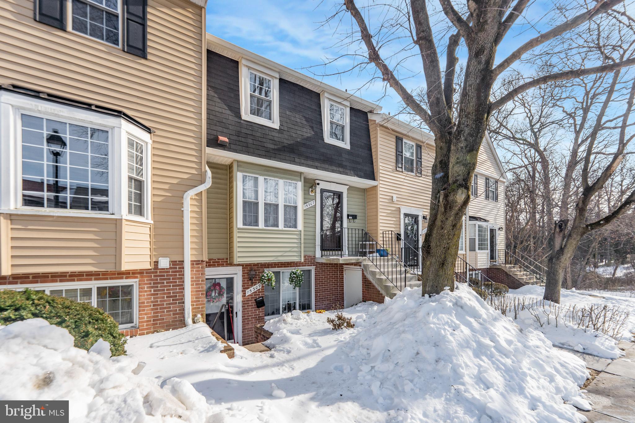 15307 Arbory Way, Unit 6 Laurel, MD 20707 - Photo 2 of 23 a view of a house with a yard covered in snow