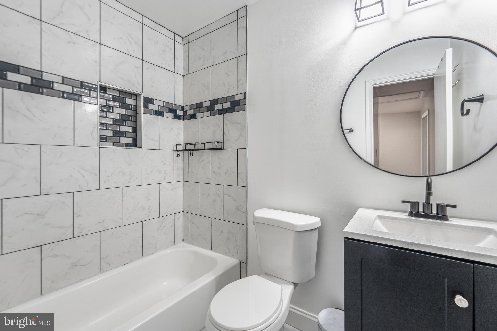 15307 Arbory Way, Unit 6 Laurel, MD 20707 - Photo 23 of 23 a bathroom with a sink toilet and shower