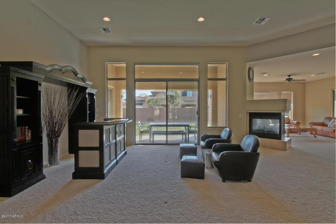 1711 West Brianna Road Phoenix, AZ 85085 - Photo 14 of 35 Living Room with Door to Patio