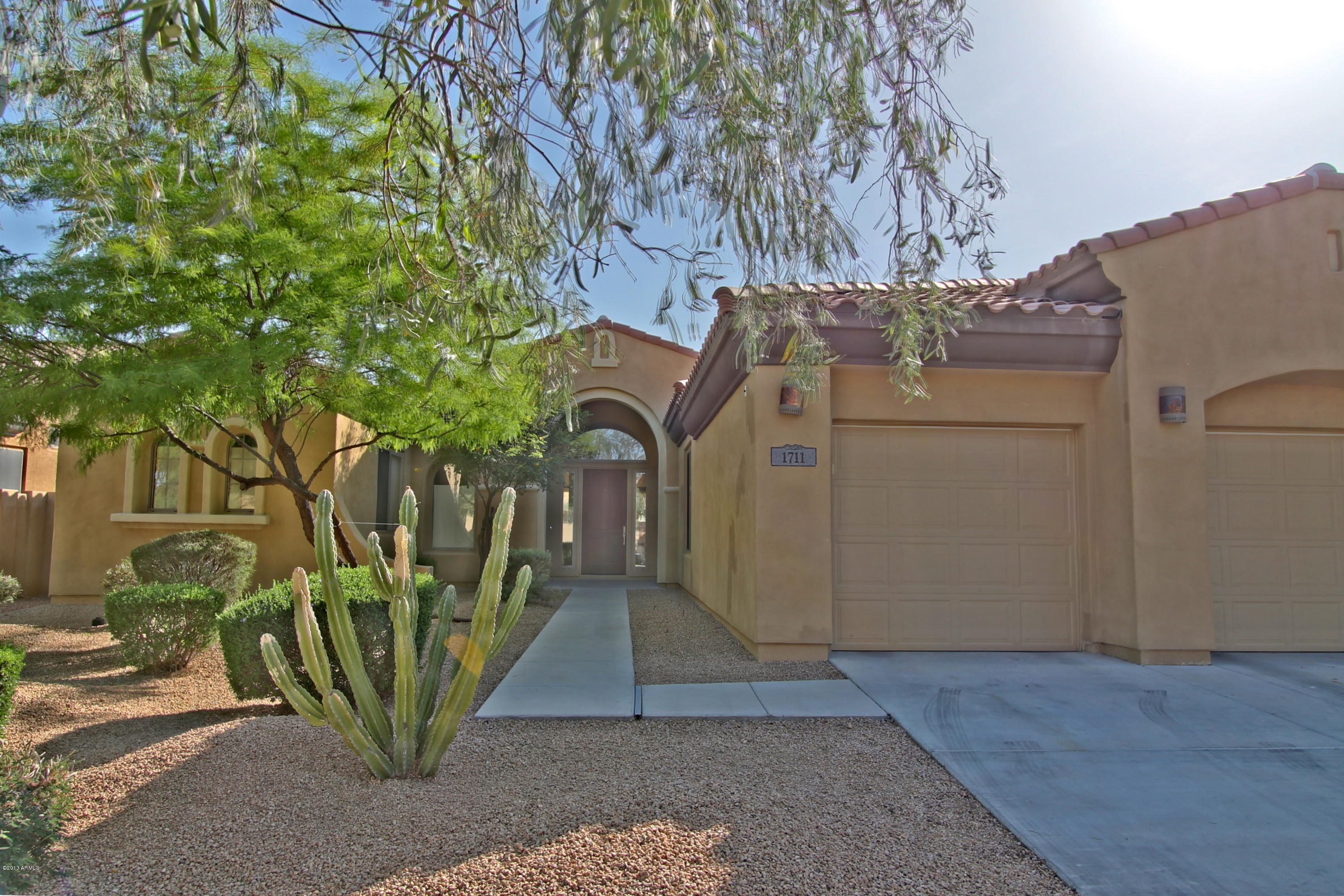1711 West Brianna Road Phoenix, AZ 85085 - Photo 2 of 35 Front of Home with 3 Car Garage