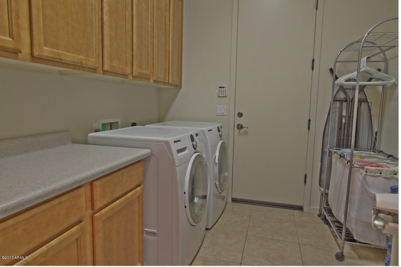 1711 West Brianna Road Phoenix, AZ 85085 - Photo 25 of 35 Laundry Room with Additional Cabinets