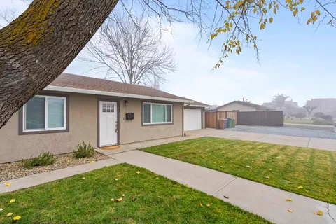 a front view of a house with garden