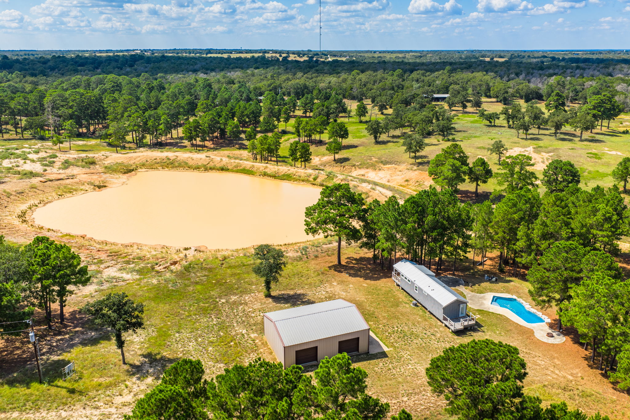 212 Meuth Cemetery Road Red Rock, TX 78662 - Photo 1 of 38 Bird's eye view of a nearby body of water
