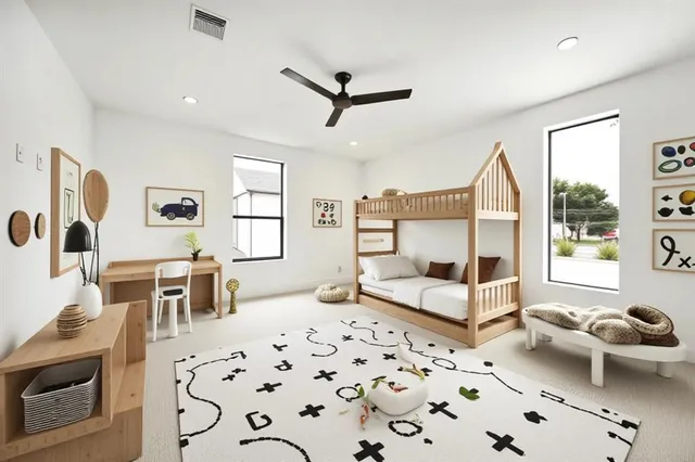 a bedroom with furniture and a large window