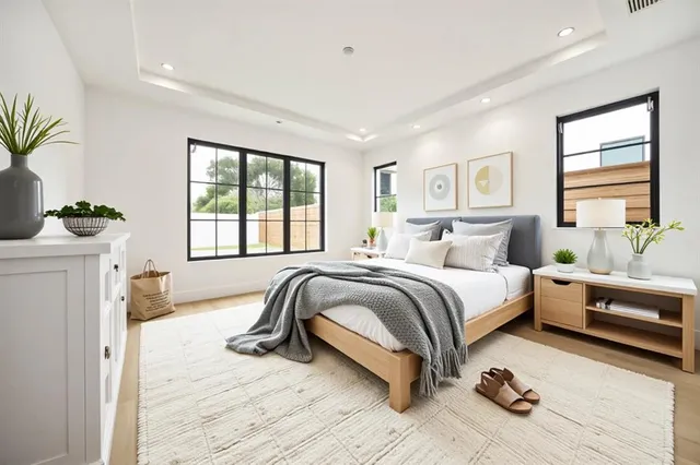 a spacious bedroom with a bed and a couch