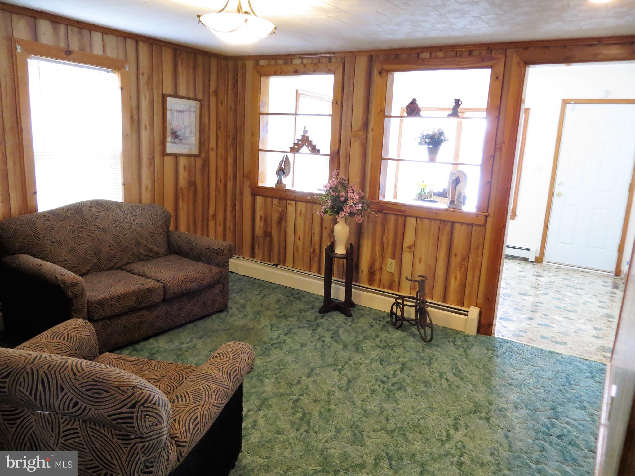 711 Hartly Road Hartly, DE 19953 - Photo 8 of 28 Living room opens to sunroom