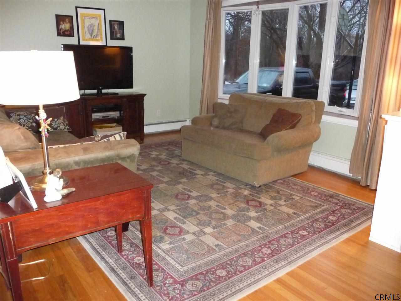 2452 Kraft Road Schodack, NY 12033 - Photo 7 of 25 Bow window and refinished hardwoods