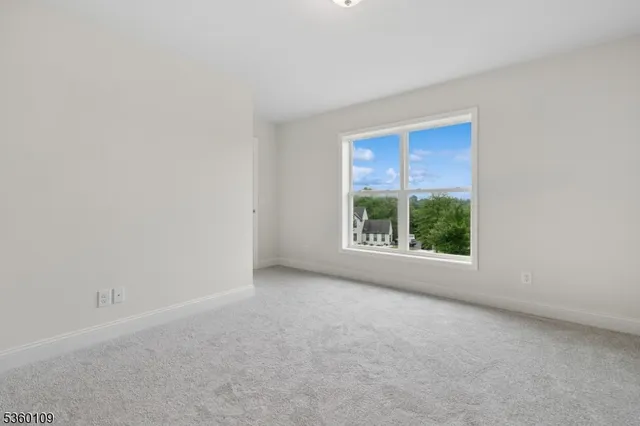 a bathroom with a granite countertop toilet a sink and a mirror