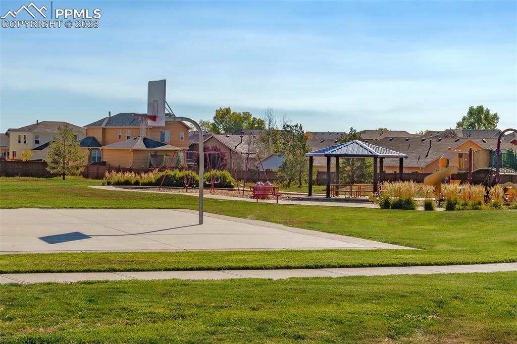 10751 Rolling Mesa Drive Peyton, CO 80831 - Photo 9 of 27 a view of a big house with a big yard and potted plants