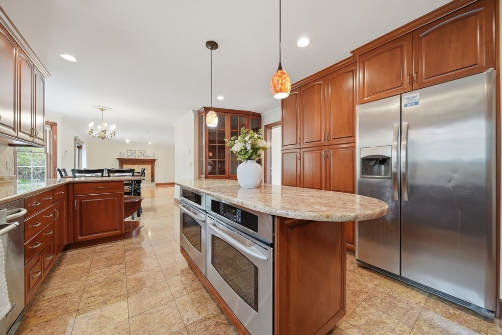 131 Range Heights Road Lynn, MA 01904 - Photo 9 of 36 a kitchen with stainless steel appliances granite countertop a sink a stove and a refrigerator