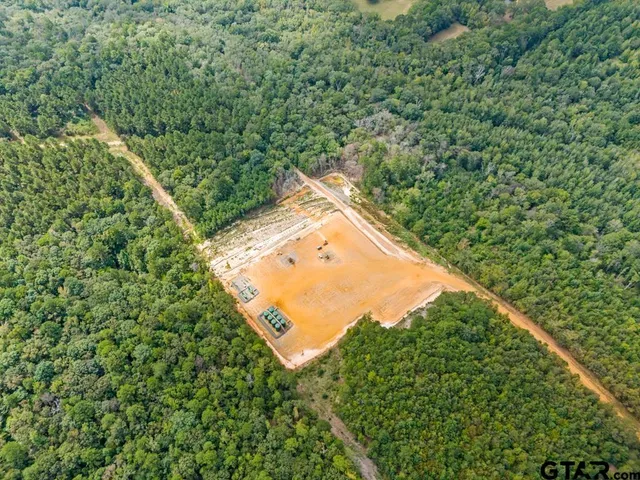 a view of outdoor space with lots of trees