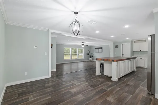 a view of kitchen with furniture and wooden floor