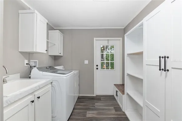 a kitchen with a stove a sink and a refrigerator