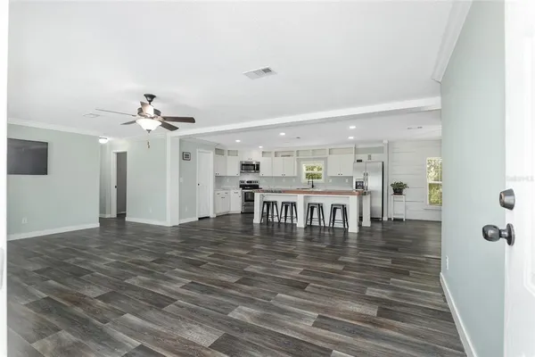 a view of a room with lots of wooden floor