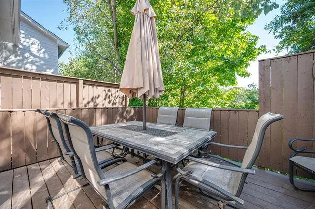 a bathroom with a granite countertop sink toilet and a mirror
