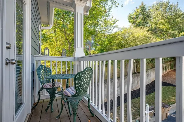 a bathroom with a granite countertop toilet a sink and a mirror