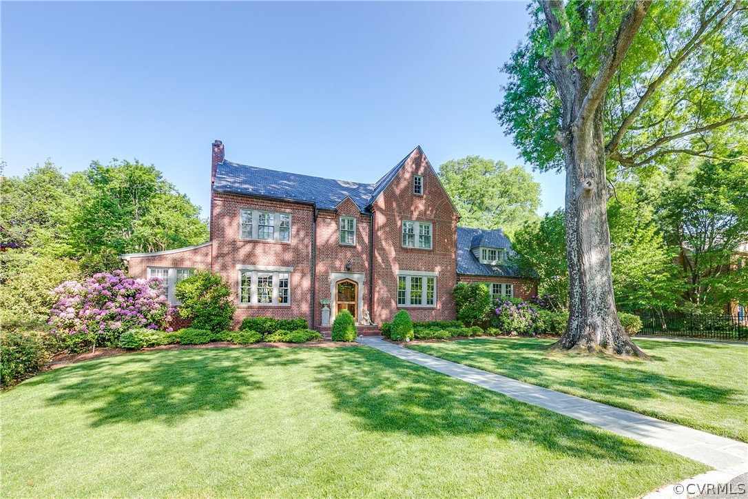 14 Roslyn Road Richmond, VA 23226 - Photo 1 of 49 a front view of a house with a yard and potted plants