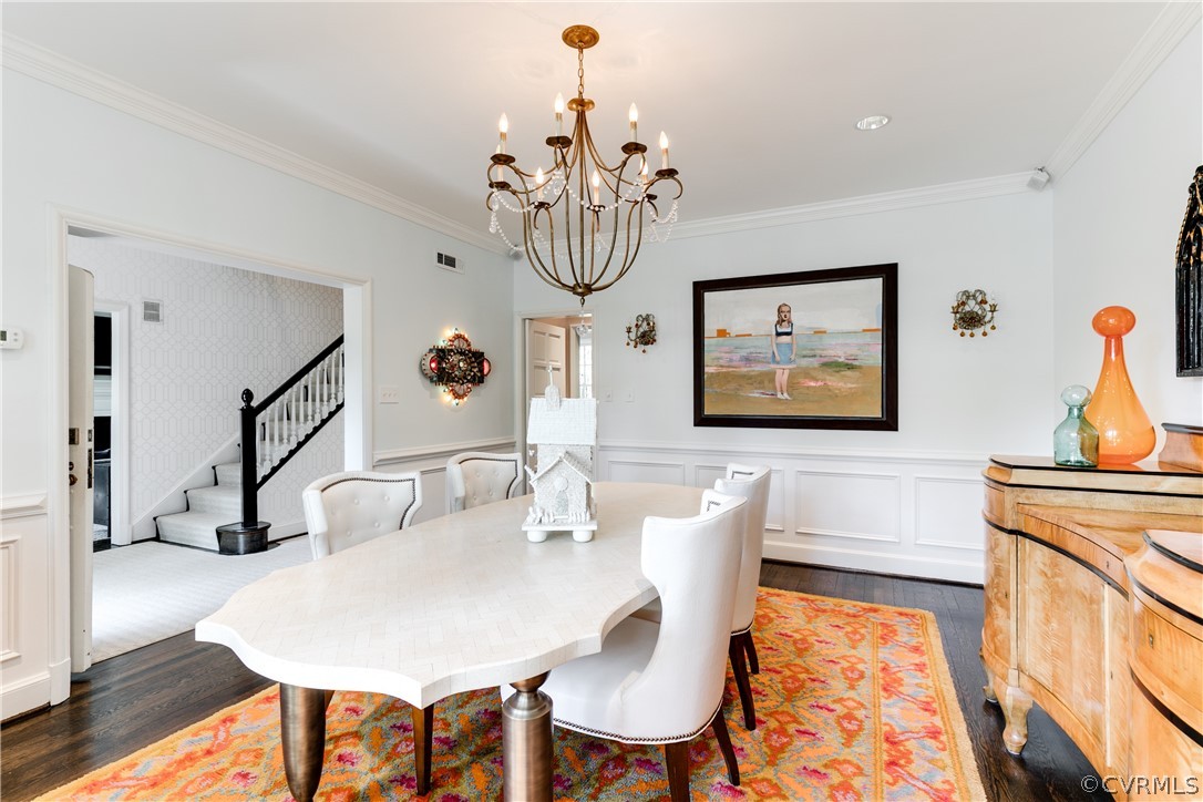 14 Roslyn Road Richmond, VA 23226 - Photo 12 of 49 a dining room with wooden floor a chandelier a wooden table and chairs