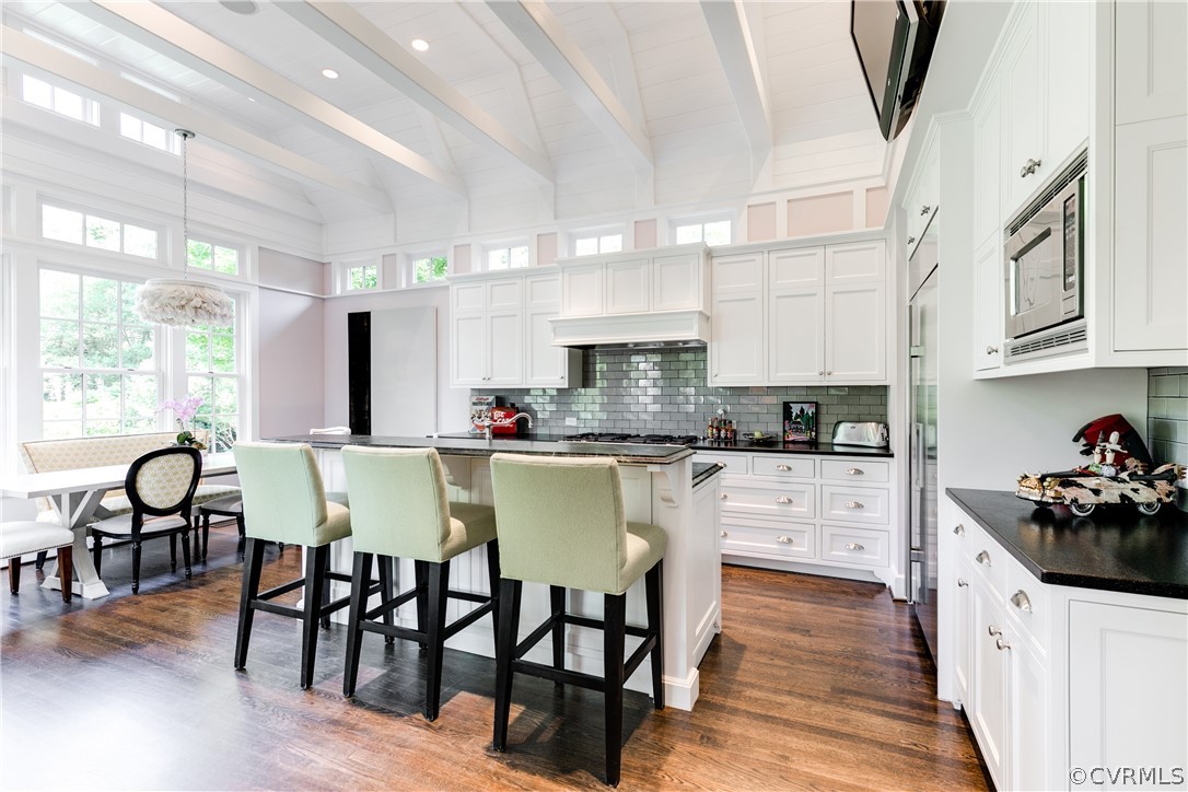 14 Roslyn Road Richmond, VA 23226 - Photo 15 of 49 a kitchen with stainless steel appliances granite countertop a stove a sink a refrigerator dining table and chairs