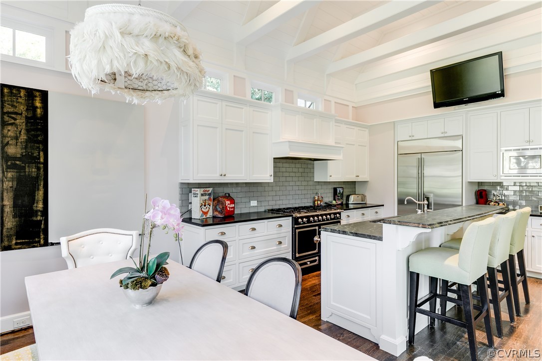 14 Roslyn Road Richmond, VA 23226 - Photo 18 of 49 a kitchen with stainless steel appliances a white table and chairs in it