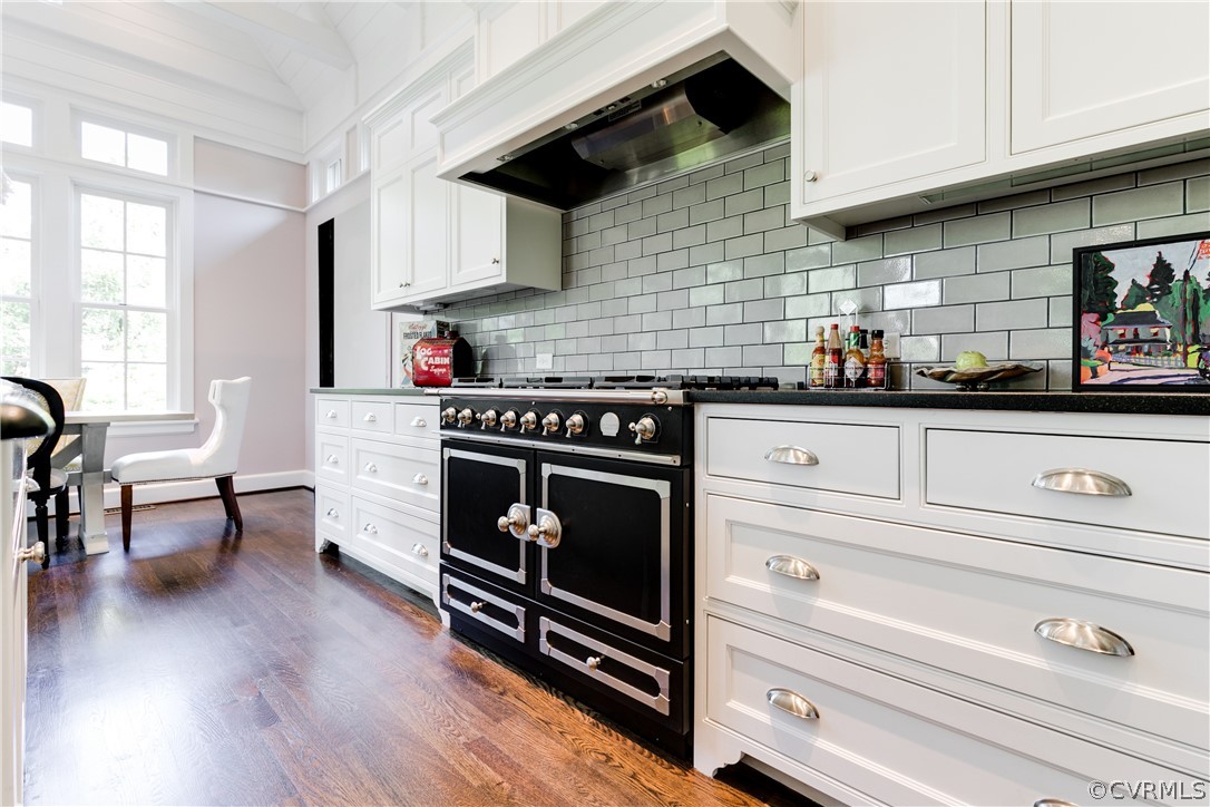 14 Roslyn Road Richmond, VA 23226 - Photo 19 of 49 a kitchen with stainless steel appliances wooden floor sink and wooden cabinets