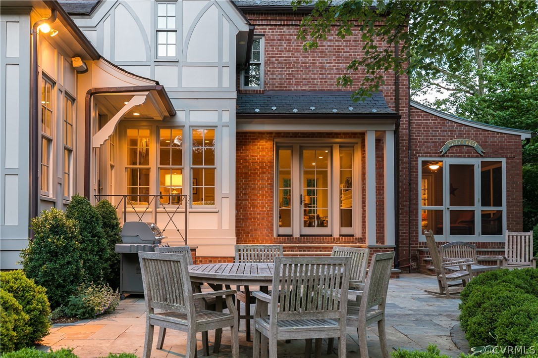 14 Roslyn Road Richmond, VA 23226 - Photo 42 of 49 a view of a house with a chairs and table in a patio