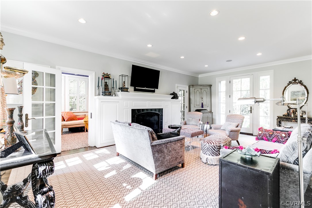 14 Roslyn Road Richmond, VA 23226 - Photo 10 of 49 a living room with furniture a flat screen tv and a fireplace