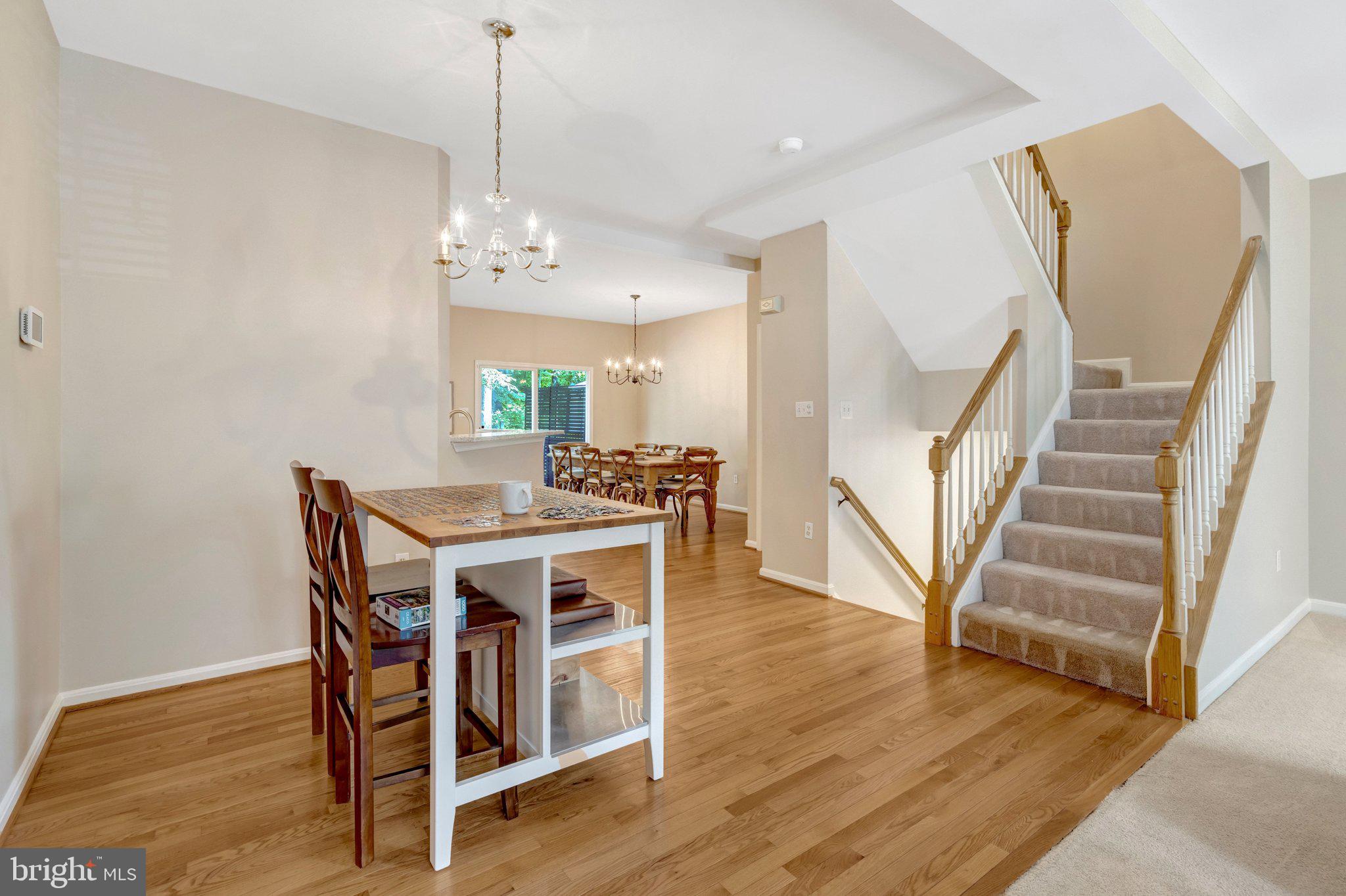 7706 Shadowcreek Terrace Springfield, VA 22153 - Photo 30 of 30 a view of a dining room with furniture and wooden floor